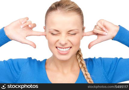 picture of smiling woman with fingers in ears