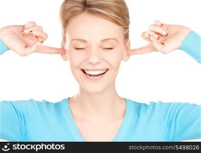 picture of smiling woman with hands over ears