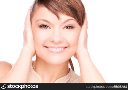 picture of smiling woman with hands over ears