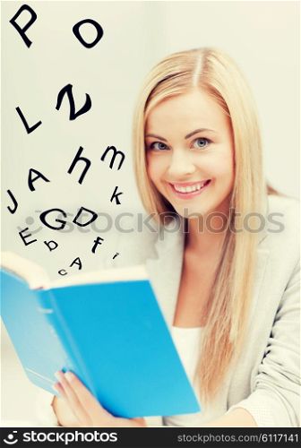 picture of smiling young woman reading book. young woman reading book