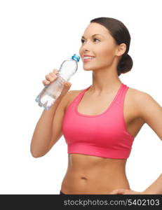 picture of sporty woman drinking water from bottle