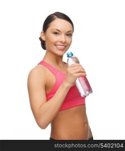 picture of sporty woman drinking water from bottle
