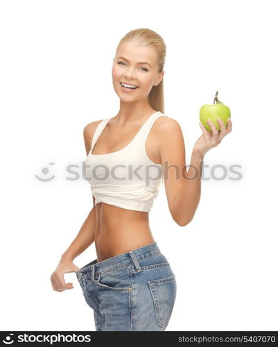 picture of sporty woman showing big pants and apple