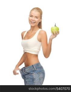 picture of sporty woman showing big pants and apple
