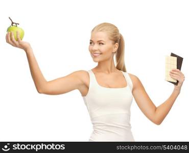 picture of sporty woman with apple and chocolate bars