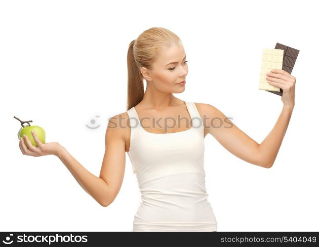 picture of sporty woman with apple and chocolate bars