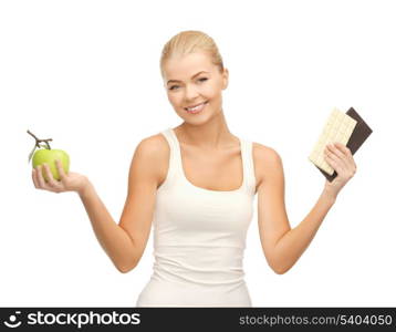 picture of sporty woman with apple and chocolate bars