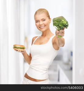 picture of sporty woman with broccoli and hamburger