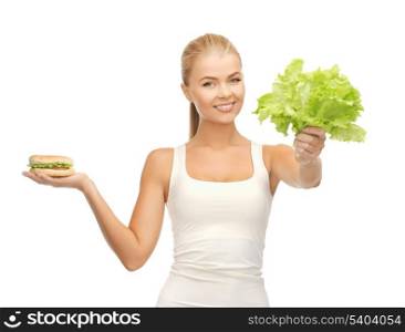 picture of sporty woman with green leaves and hamburger