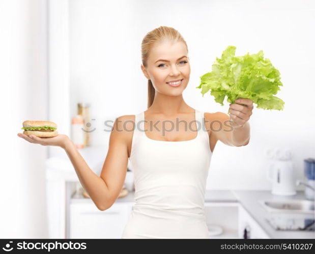 picture of sporty woman with green leaves and hamburger