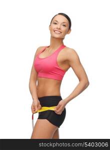 picture of sporty woman with measuring tape