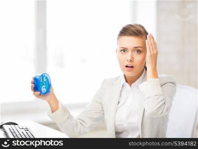picture of stressed businesswoman holding clock