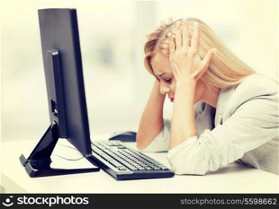 picture of stressed businesswoman with computer at work