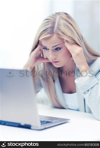 picture of stressed businesswoman with laptop at work. stressed woman with laptop