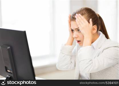 picture of stressed student with computer in office