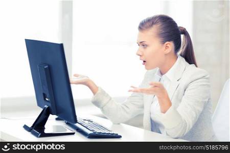 picture of stressed student with computer in office. stressed student with computer in office