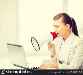 picture of strict businesswoman shouting in megaphone