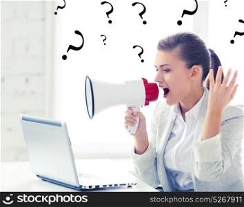 picture of strict businesswoman shouting in megaphone. strict businesswoman shouting in megaphone