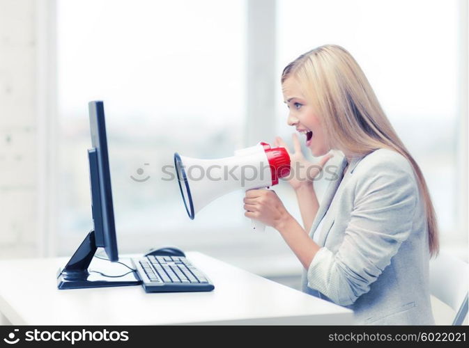 picture of strict businesswoman shouting in megaphone. strict businesswoman shouting in megaphone