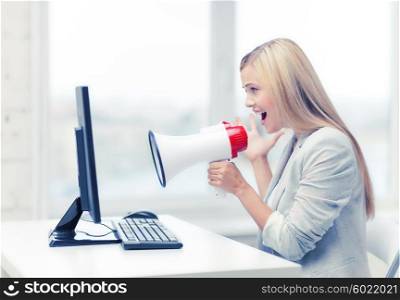picture of strict businesswoman shouting in megaphone. strict businesswoman shouting in megaphone