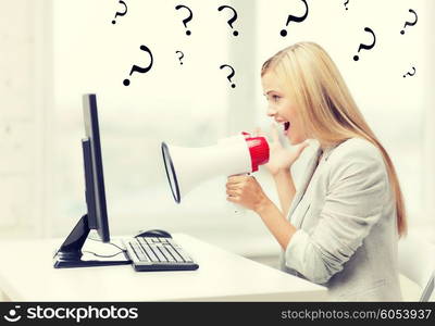 picture of strict businesswoman shouting in megaphone. strict businesswoman shouting in megaphone