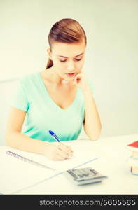 picture of student girl with notebook and calculator