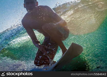 Picture of Surfing a Wave at Sunrise Time