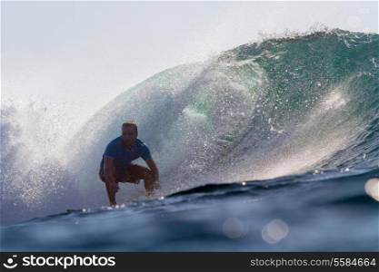 Picture of Surfing a Wave at Sunrise Time