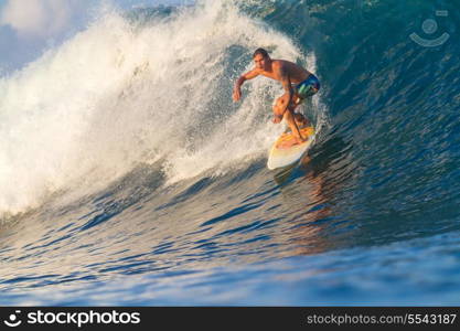 Picture of Surfing a Wave.Sumbawa Island. Indonesia.