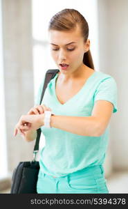 picture of surprised student girl looking at clock