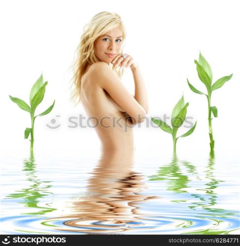 picture of tanned blonde in water with green plants