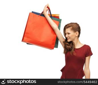 picture of teenage girl in red dress with shopping bags