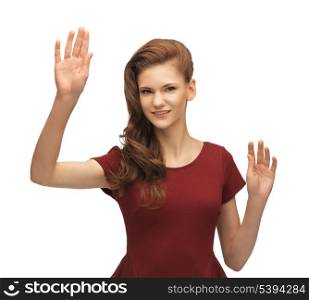 picture of teenage girl in red dress working with something imaginary