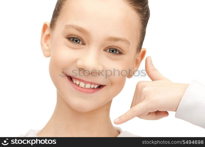 picture of teenage girl making a call me gesture