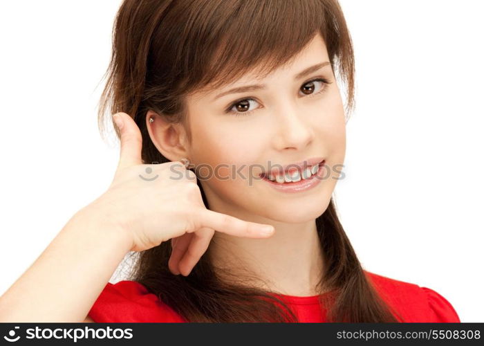 picture of teenage girl making a call me gesture