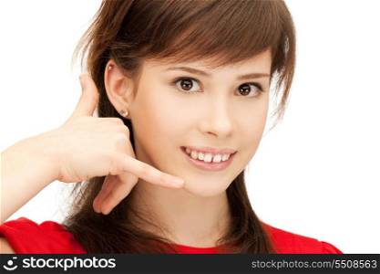 picture of teenage girl making a call me gesture