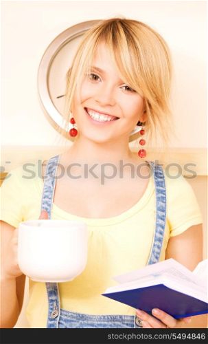 picture of teenage girl with book and mug