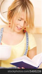 picture of teenage girl with book and mug