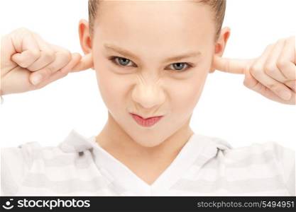 picture of teenage girl with fingers in ears