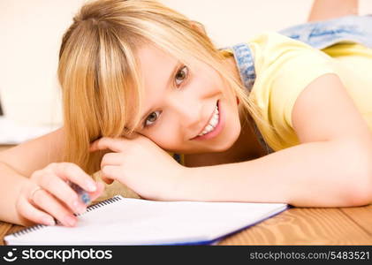 picture of teenage girl with notebook and pen