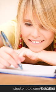 picture of teenage girl with notebook and pen