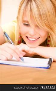 picture of teenage girl with notebook and pen
