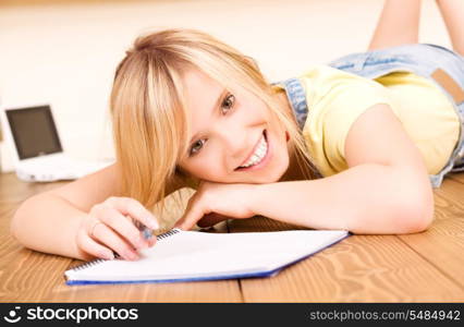 picture of teenage girl with notebook and pen