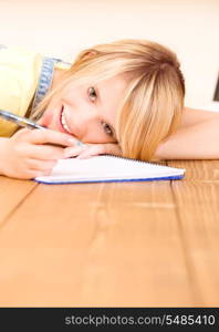 picture of teenage girl with notebook and pen