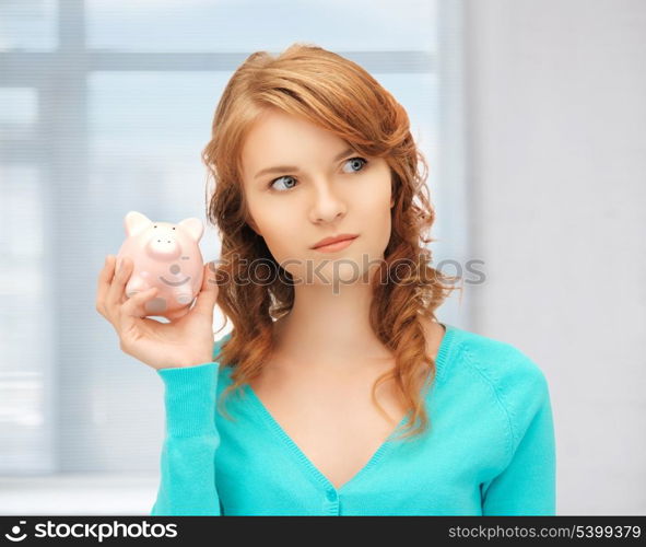 picture of teenage girl with piggy bank