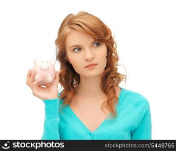picture of teenage girl with piggy bank