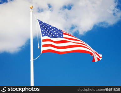 picture of the american flag flying in the wind