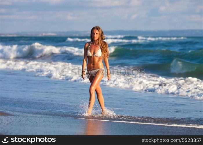 picture of the girl walking on the beach