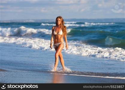picture of the girl walking on the beach