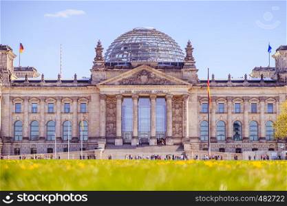 Picture of the Reichstag in Berlin in Springtime, green grass and flowers
